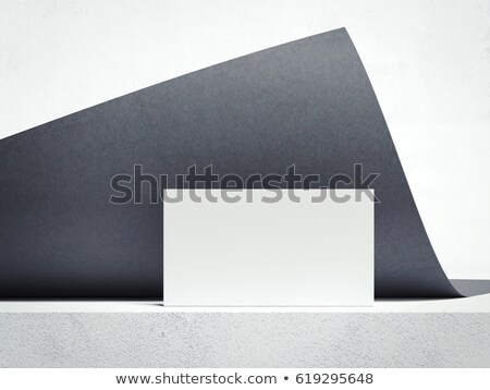 [[stock_photo]]: Dark Rolled Sheet And White Business Card 3d Rendering