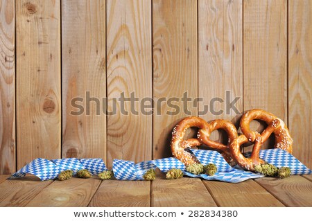 Stok fotoğraf: Two Pretzels On A Bavarian Diamond Pattern