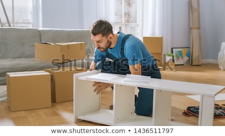 Stock photo: Man Assembling Furniture At Home Hand With Screwdriver