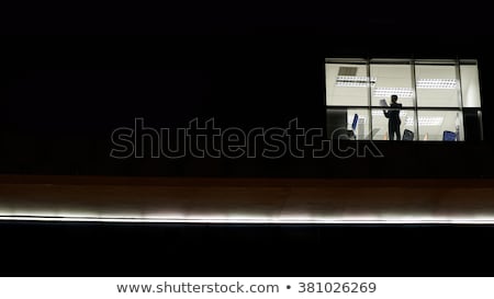 [[stock_photo]]: Businessman In The Office At Night