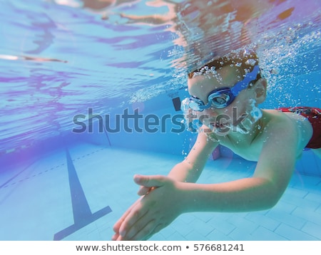 Stock foto: Toddler Boy Swims In The Pool