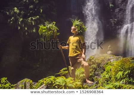 [[stock_photo]]: Cute Boy Depicts The King Of The Jungle Against The Backdrop Of A Waterfall Childhood Without Gadge