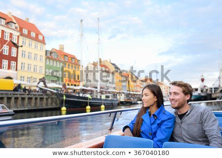 [[stock_photo]]: Copenhagen Tourists People On Denmark Travel Holiday Cruise Boat Tour In Old Port Young Multiracial