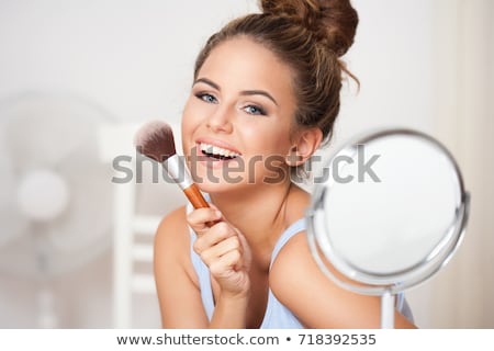 Young Brunette Woman With Makeup Brush ストックフォト © lithian