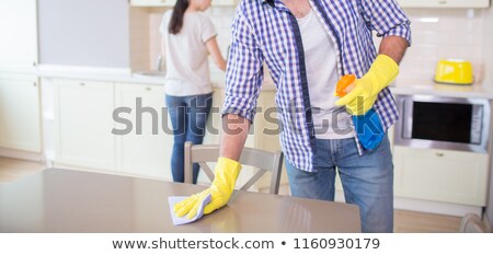 Foto d'archivio: Men Doing Housework