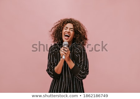 Stock photo: Young Brunette With Microphone
