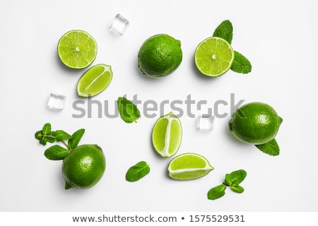 Stockfoto: Fresh Slices Lime With Leaf Mint Isolated On White