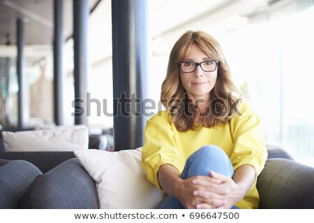 Stok fotoğraf: Middle Aged Woman Enjoying Coffee Alone