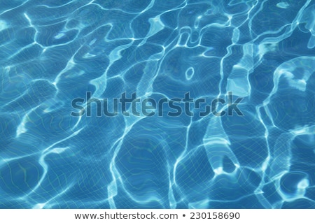 Foto stock: Blue Tile Background With Concentric Water Ripples Pattern