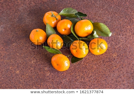Stock fotó: Fresh Ripe Tangerines On Brown Rusty Background