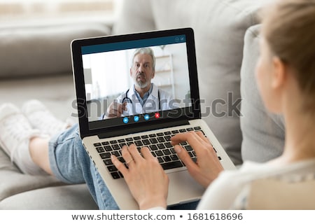 Stock fotó: Doctor And Nurse Sitting Face To Face Having Meeting