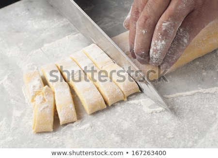 Stockfoto: Chef Cutting Pasta