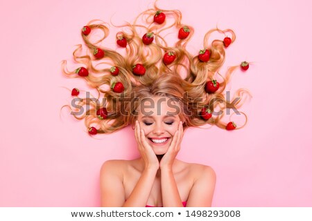 Foto stock: Woman Laughing As She Views A Photo