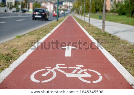 Stock fotó: Bicycle Lane Or Path Icon Symbol On Red Asphalt Road