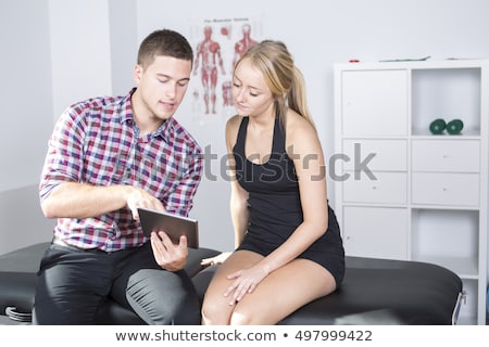 Stockfoto: Male Physio Therapist And Woman Helping Patient