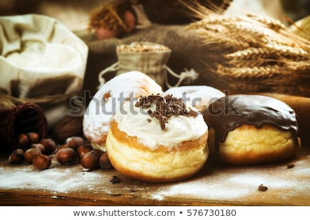 Stock photo: Frosted Sprinkled Donuts Sweet Pastry Dessert On Rustic Wooden