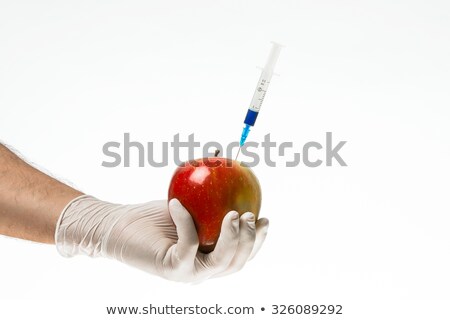[[stock_photo]]: Apple To Stick A Syringe Isolated On White Background