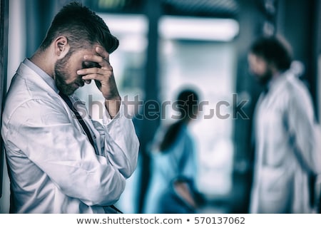 Stock photo: Well Dressed Man Leaning Against The Wall