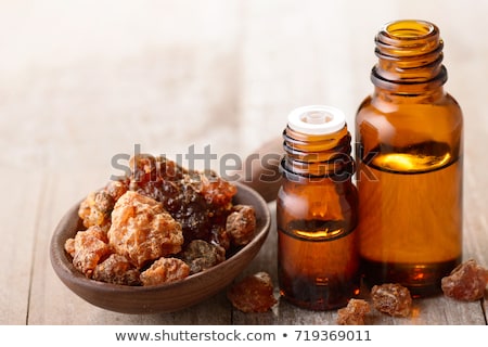 [[stock_photo]]: A Bottle Of Myrrh Essential Oil With Myrrh Resin