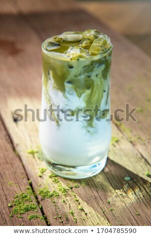 Stock photo: Green Tea Latte With Ice In Plastic Cup And Straw On Wooden Background Homemade Iced Matcha Latte T