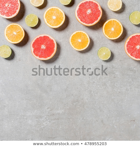 Stockfoto: Close Up Of Citrus Fruits On Stone Table