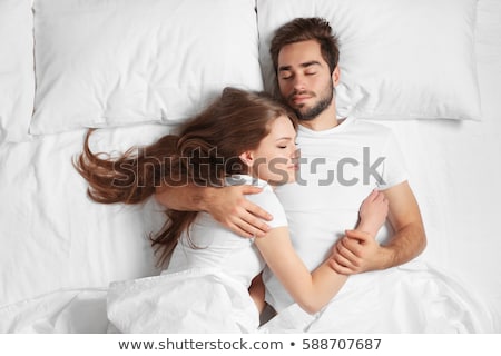 Stock fotó: Couple Sleeping On Bed