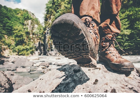 Foto stock: Feet Trekking Boots Hiking Traveler Alone Outdoor Wild Nature Lifestyle Travel Extreme Survival Conc