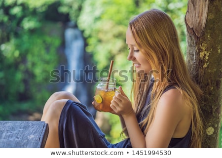 Stock photo: Iced Tea On The Background Of Waterfalls