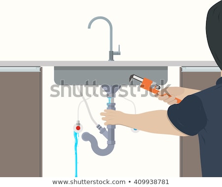 Foto stock: Plumber Fixing Under The Sink