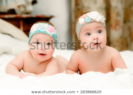 Foto stock: Two Twin Babies Girls In Nice Headbands