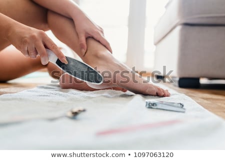 Stockfoto: Woman Filling Foot With Foot File