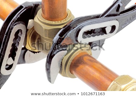 Stock photo: Plumber Fixing Copper Piping