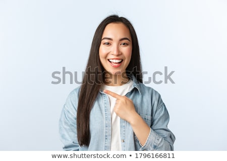 Stock photo: Young Cheerful Woman Showing Something