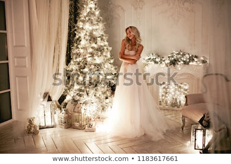 [[stock_photo]]: Blond Lady Near Fireplace In A Luxury Interior