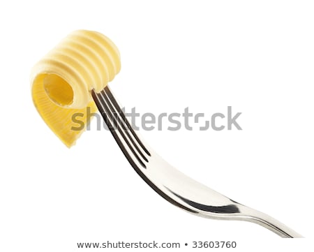 Foto stock: Butter Curl On A Fork