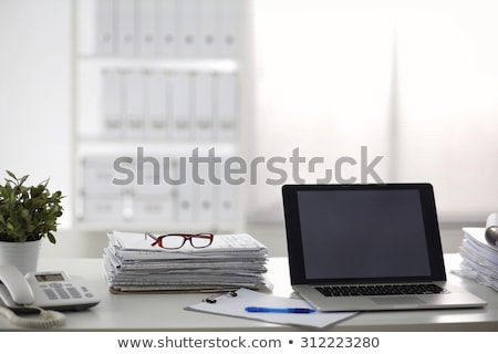 Foto stock: Office Desk With Phone Charts And Coffee