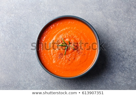 Stok fotoğraf: Tomato Soup In A Black Bowl Grey Stone Background