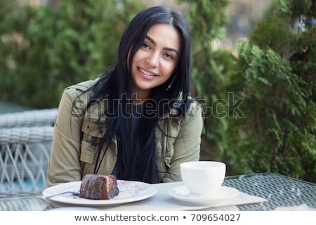 Сток-фото: Business Asian Black Haired Woman With A Cup Of Tea And Teapot