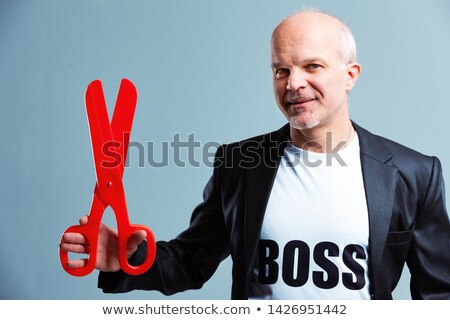 Foto d'archivio: Businessman Boss Holding Large Red Scissors