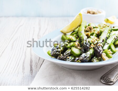Stok fotoğraf: Close Up With Selective Focus On Roasted Asparagus Seasoned With