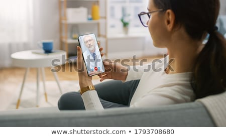 Stock photo: Medical Professional Talking On Her Mobile Phone