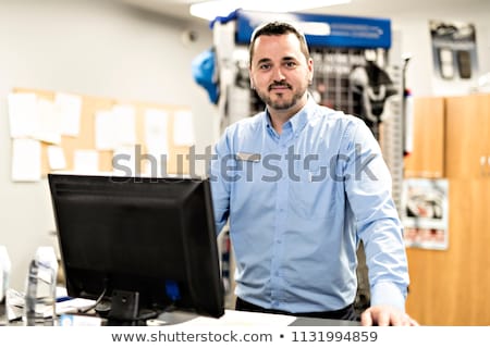 Stock photo: Merchandiser Checking Products Availibility For Car Repair