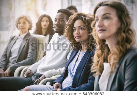 Сток-фото: Front View Of Attentive Mixed Race Young Businesswoman In A Business Seminar In Office