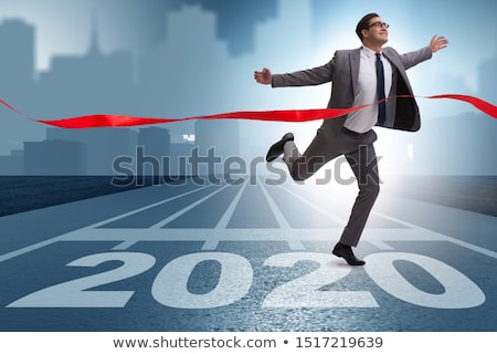 ストックフォト: Businessman On Finishing Line In Race For 2019