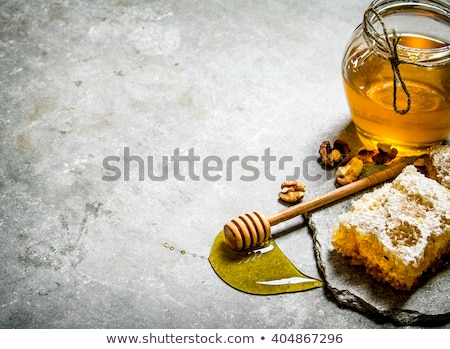 Foto stock: Honey Honeycombs On A Grey Stone Background