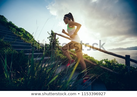 Foto stock: Woman Exercising On Staircase