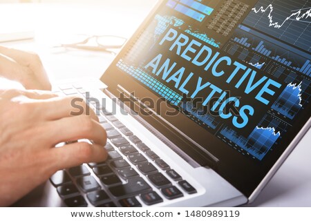 Stockfoto: Businessman Working On Laptop Doing Predictive Analytics