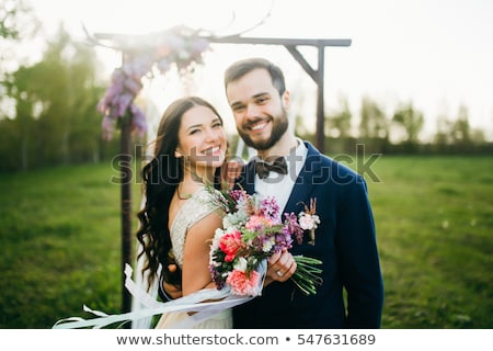 Stockfoto: Beautiful Wedding Couple Hugging In The Park