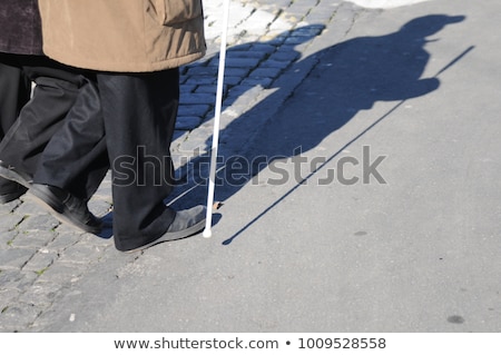 Stockfoto: Woman Assisting Blind Man On Street