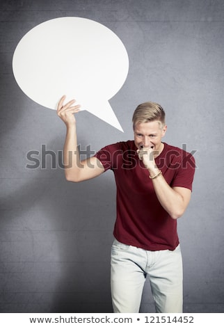 Stock photo: Worried Man Biting His Hand While Holding Blank Speech Bubble